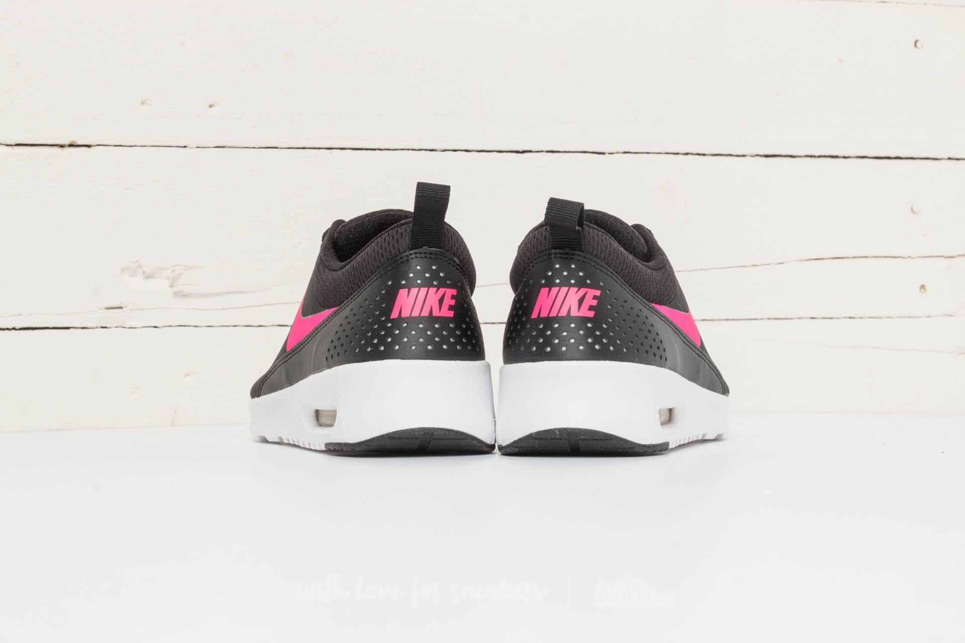 Nike thea on sale pink and black