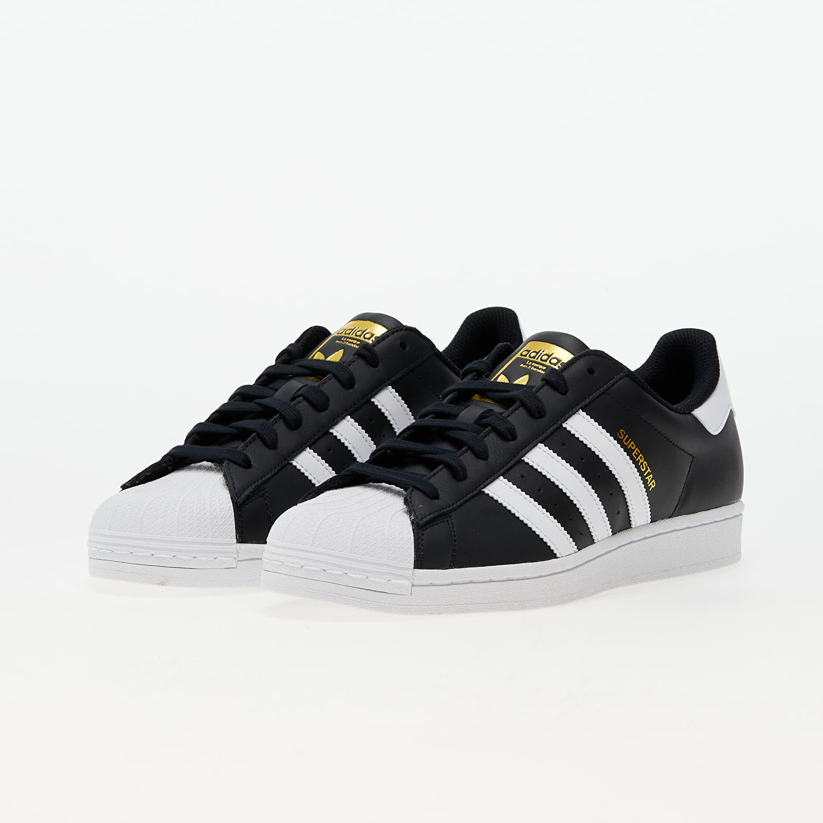 White and black superstar adidas sale