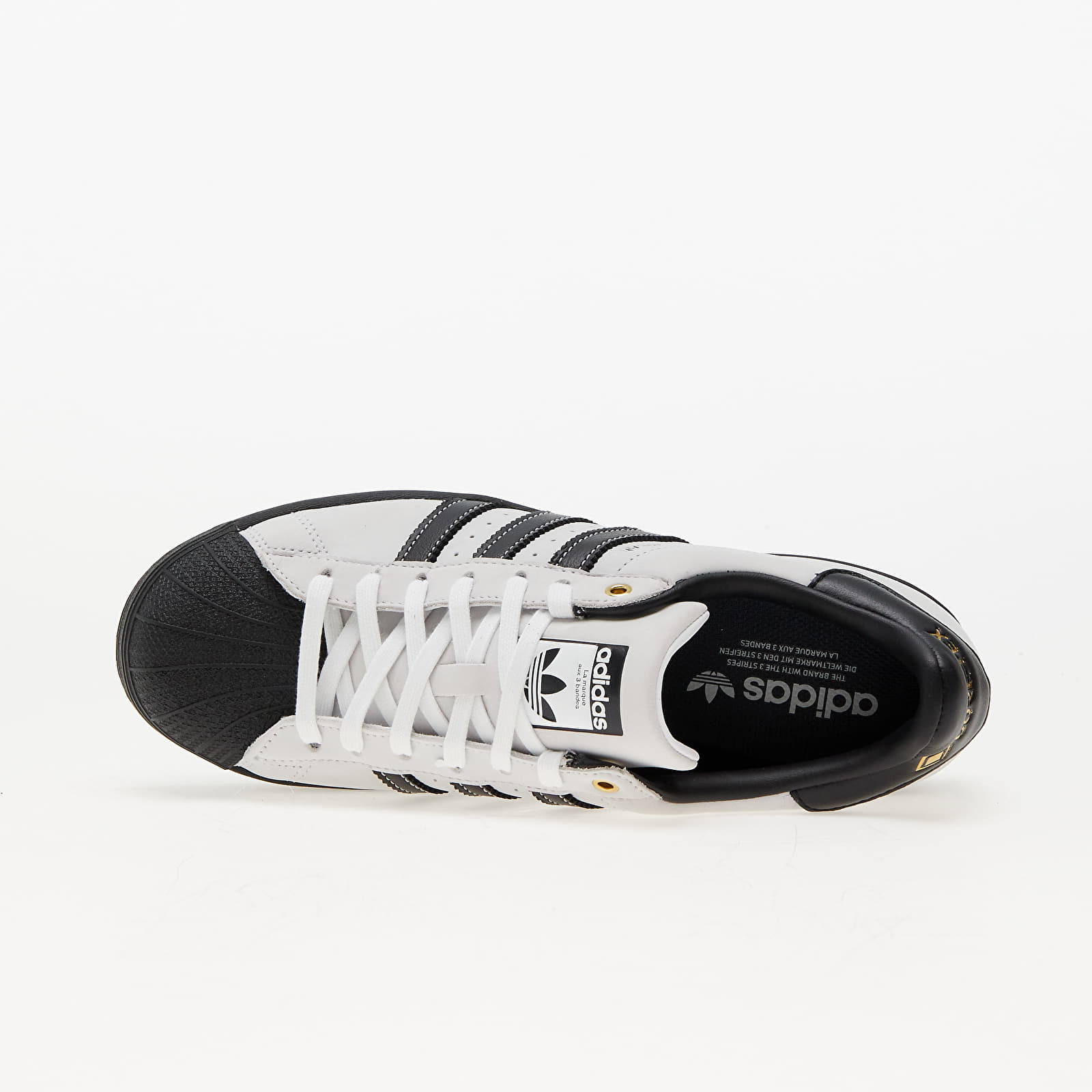 Black adidas sneakers with white stripes top
