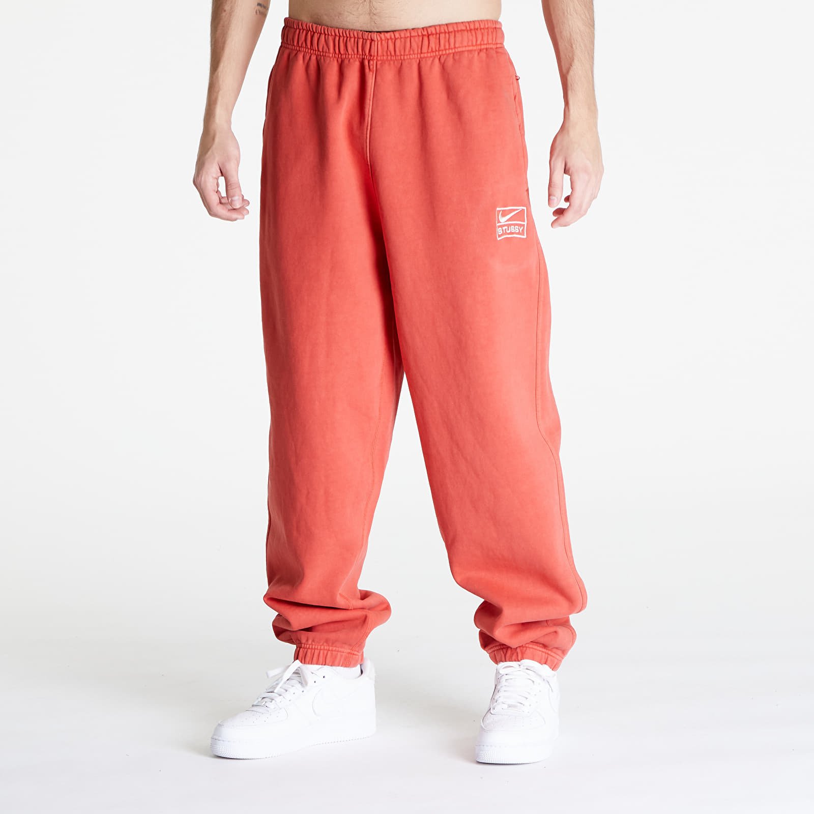 Pantaloni della tuta  Nike U NRG x Stüssy Fleece Pants Habanero Red/ Natural