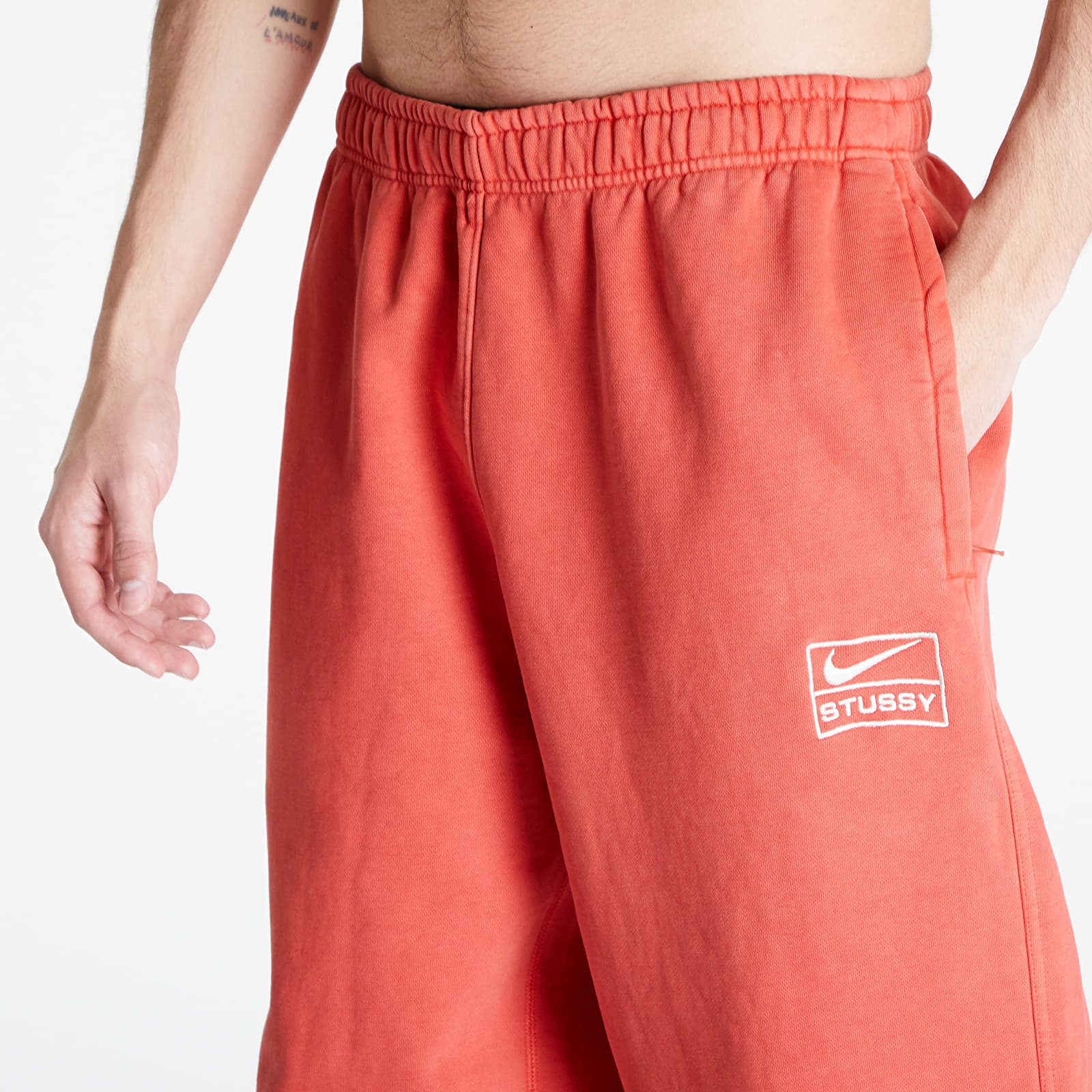 Pantaloni della tuta  Nike U NRG x Stüssy Fleece Pants Habanero Red/ Natural