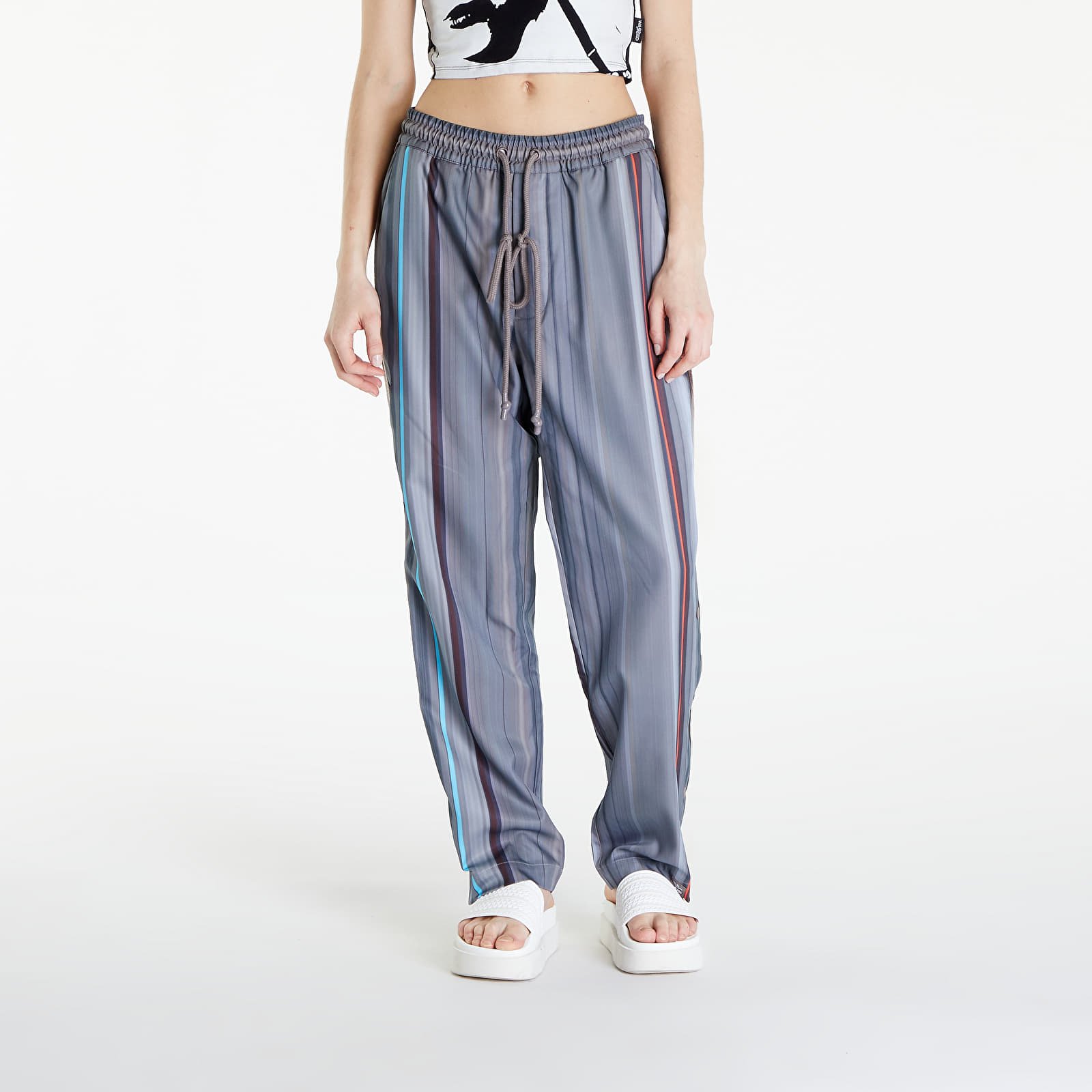 Džíny a kalhoty adidas x Song For The Mute Allover Print Pants UNISEX Brown