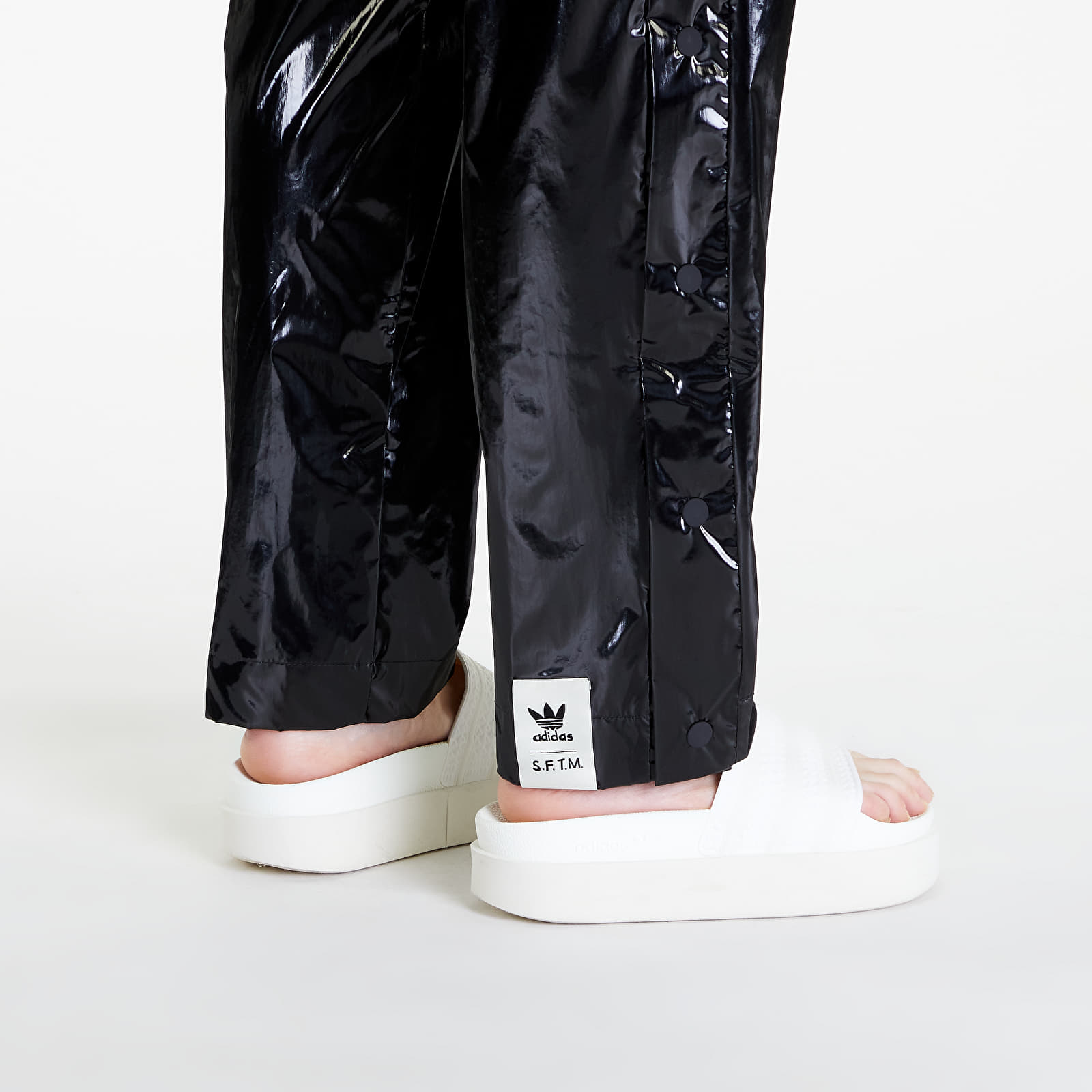 Džíny a kalhoty adidas x Song For The Mute Shiny Pants UNISEX Black/ Active Teal