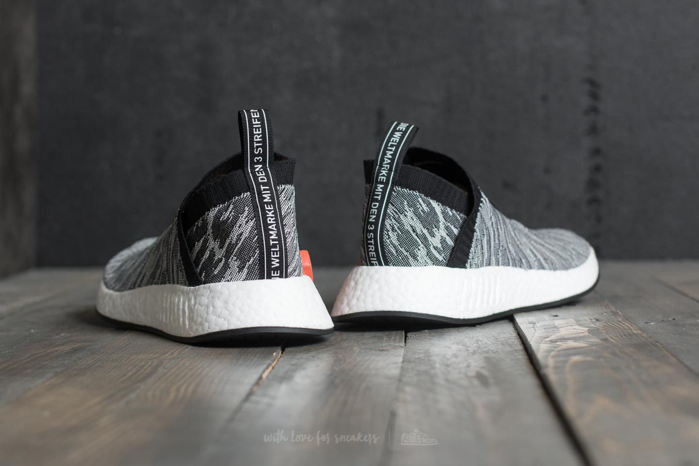 Adidas originals mens nmd_cs2 store primeknit trainers schwarz/schwarz/future harvest