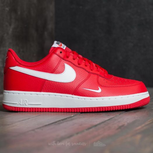 red nike shoes with white swoosh