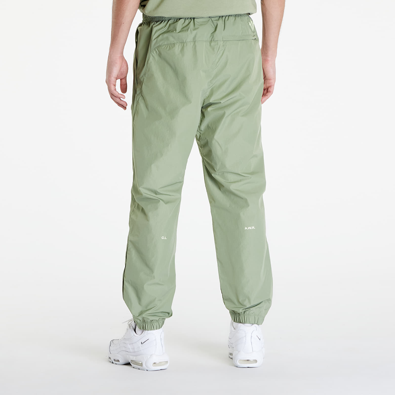 Džíny a kalhoty Nike x NOCTA Woven Track Pants Oil Green/ Light Liquid Lime