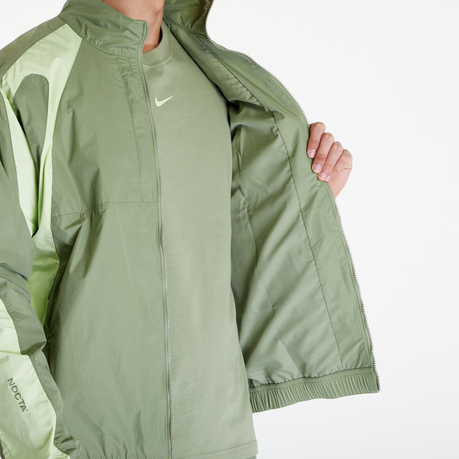 Dzsekik Nike x NOCTA Men's Woven Track Jacket Oil Green/ Lt Liquid Lime/ Lt Liquid Lime