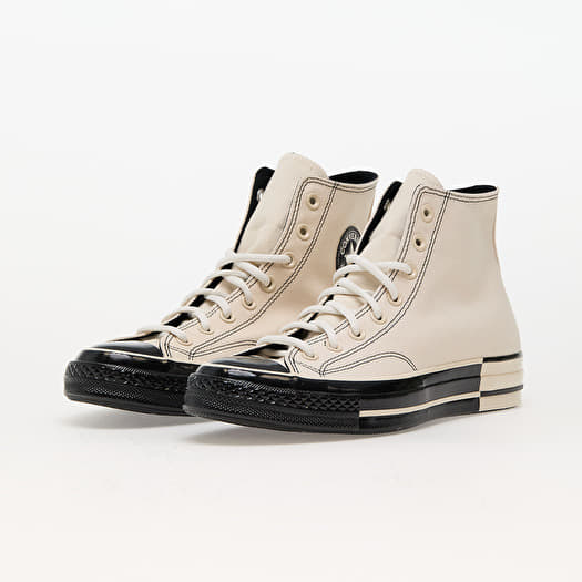 Black and white low top chucks discount