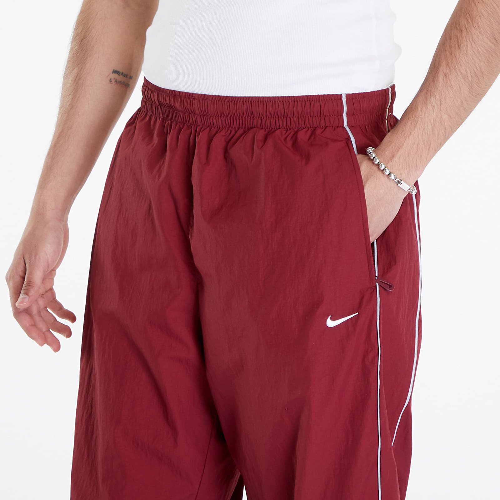 Pants and jeans Nike Solo Swoosh Men s Track Pants Team Red White Footshop