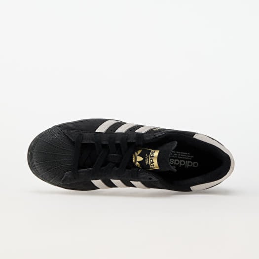 Black and gold adidas superstar womens discount