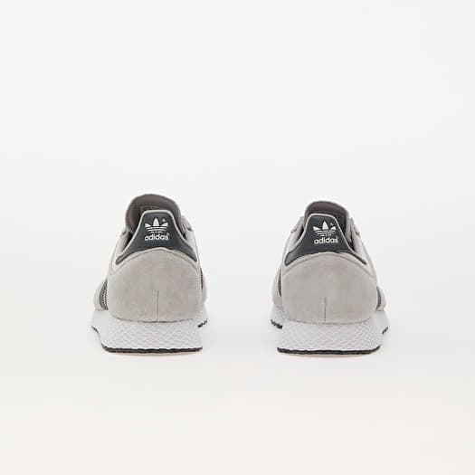 Grey and white adidas trainers top