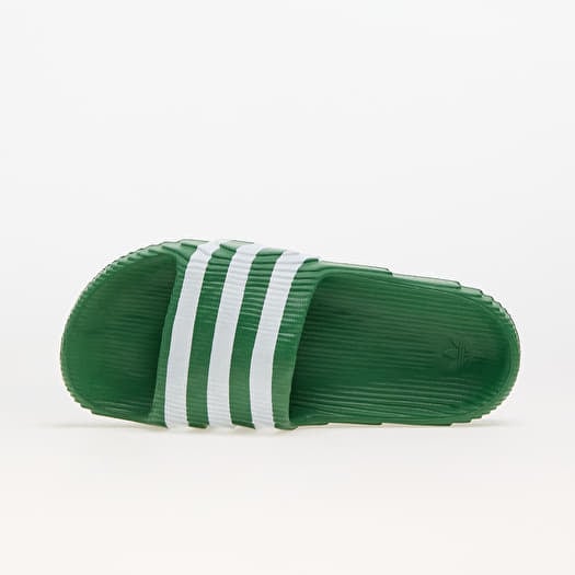 Green and white adidas slides top