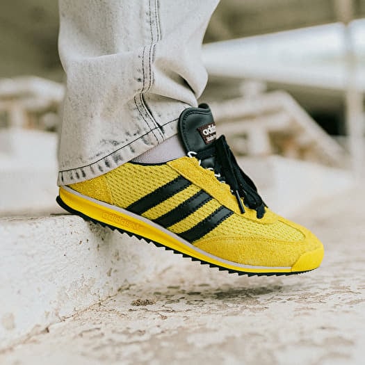 Yellow and black adidas shoes top