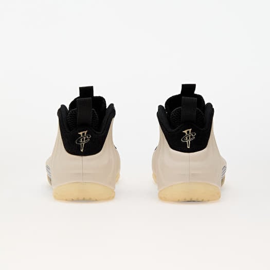 Black and gold foams mens top