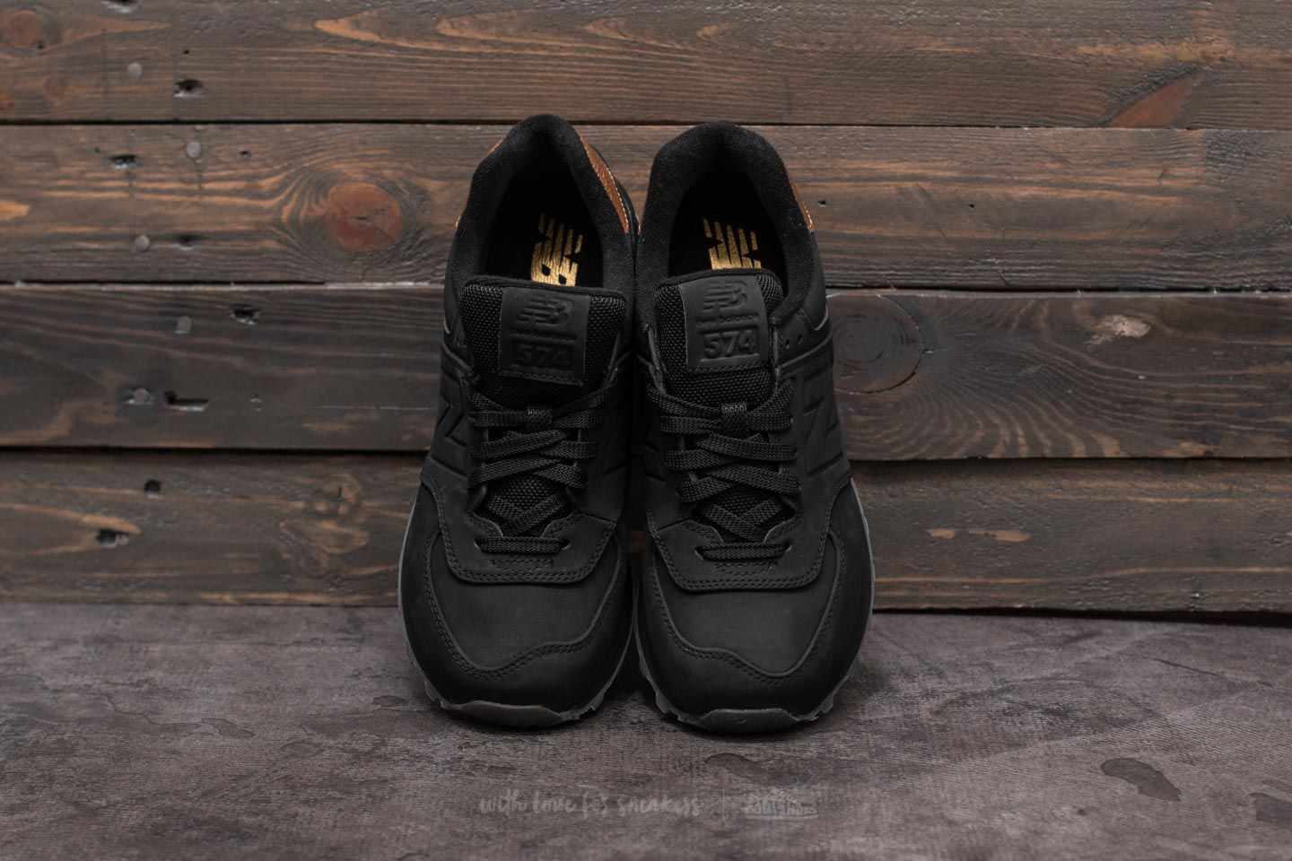 New balance 574 womens black and gold top