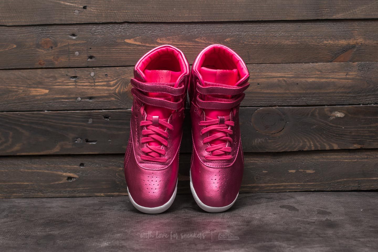 Hot pink high top reeboks shop