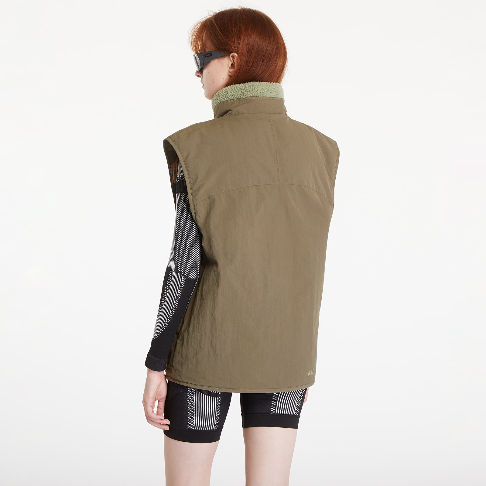 Vesty adidas City Escape Reversible Vest Tent Green / Olive Strata