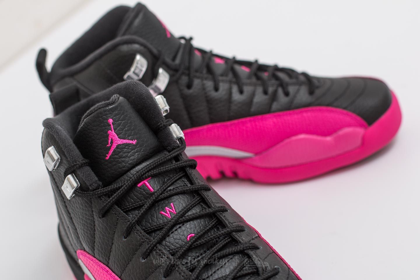 Black and pink jordan 12 sales