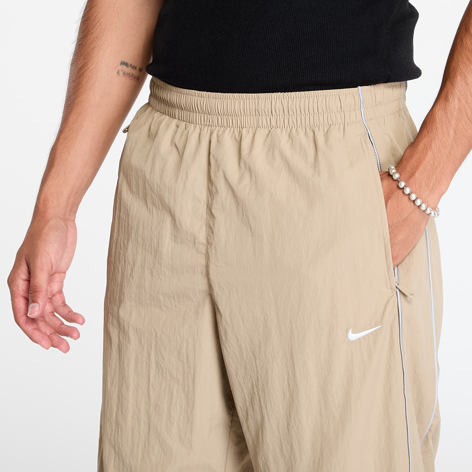 Džíny a kalhoty Nike Solo Swoosh Men's Track Pants Khaki/ White