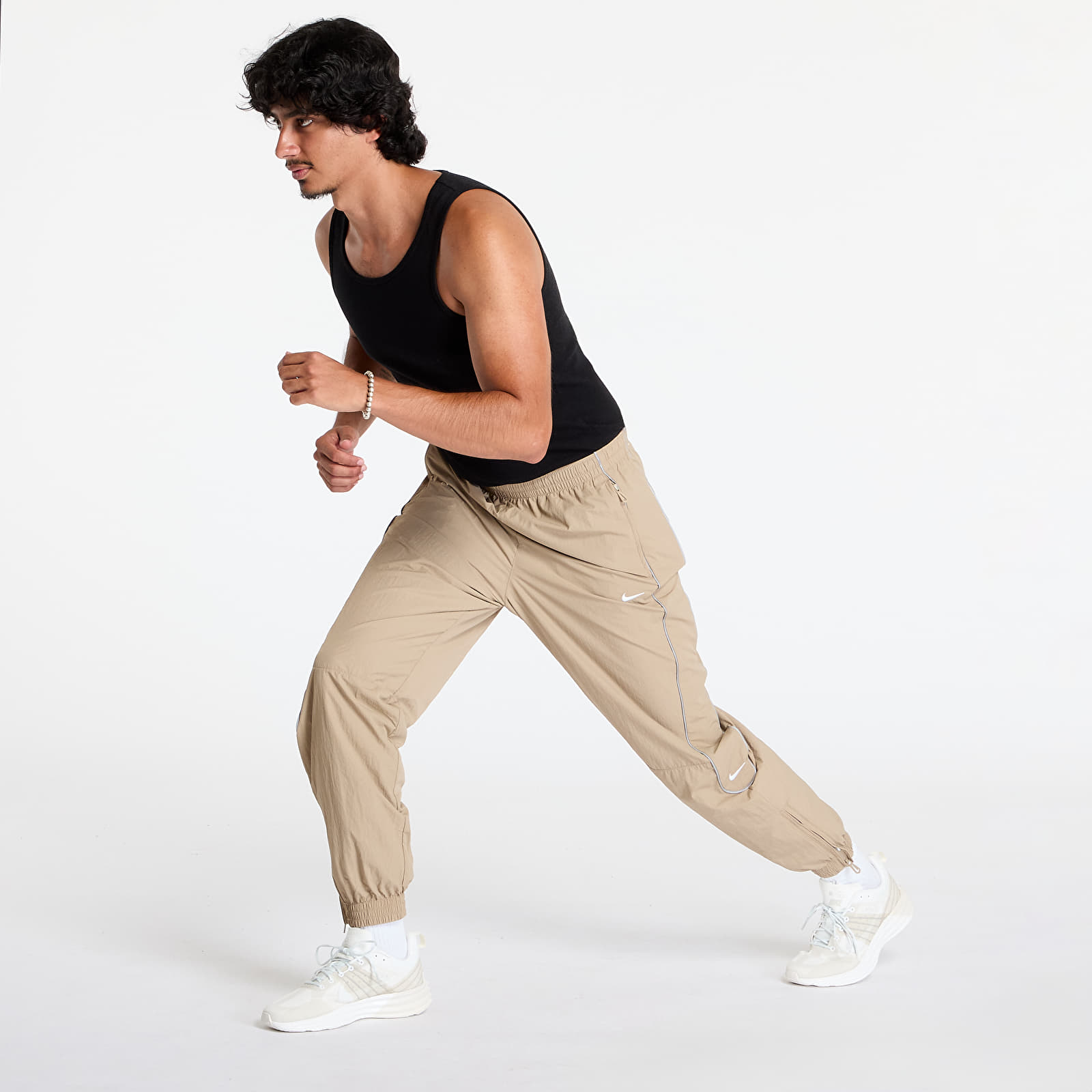 Džíny a kalhoty Nike Solo Swoosh Men's Track Pants Khaki/ White