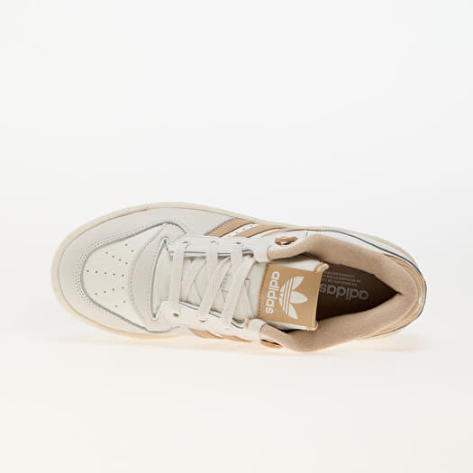 tan and white adidas