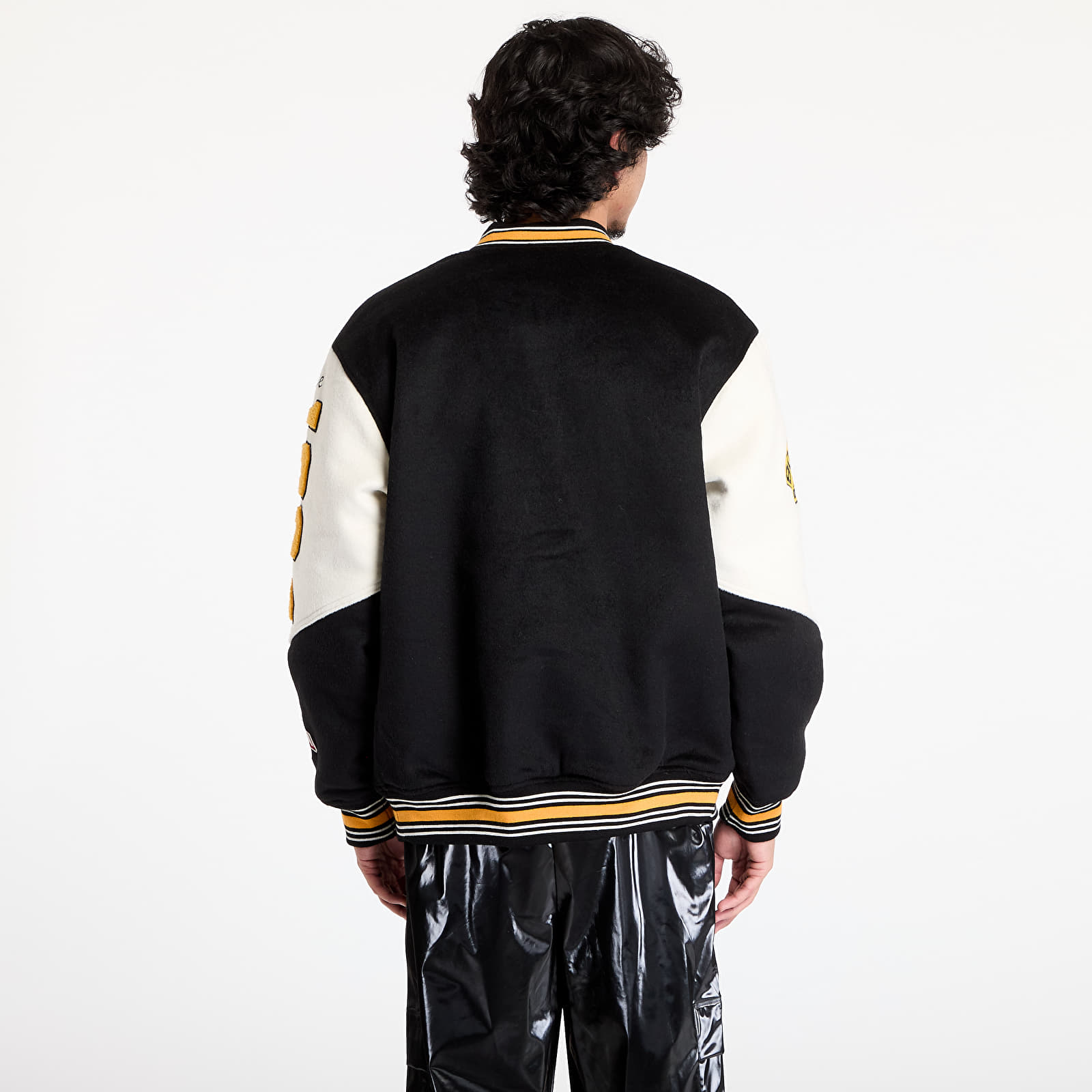 Bombery Mitchell & Ness NHL Team History Varsity Jacket Current Logo Bruins Black