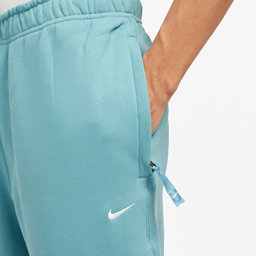 Jeans e pantaloni Nike Solo Swoosh Men s Fleece Pants Denim Turq White Footshop