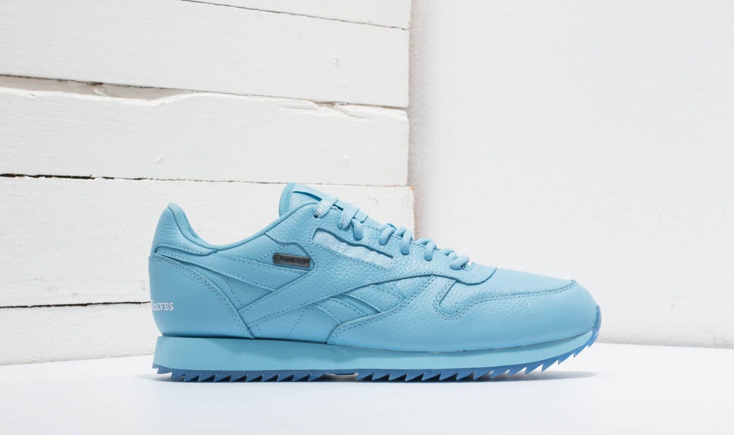 Reebok raised by wolves blue top