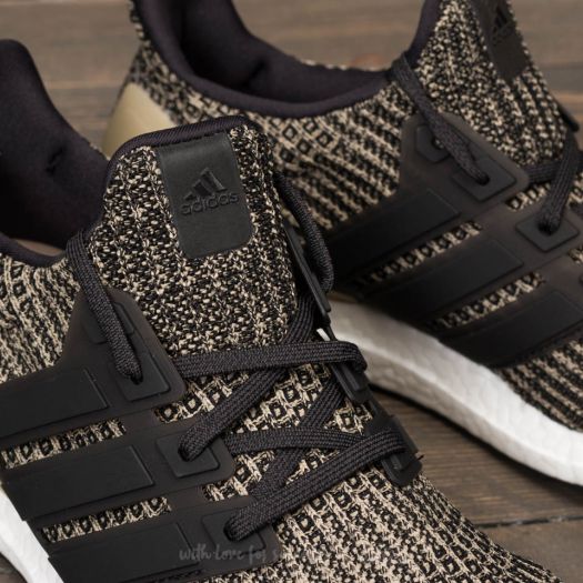 Adidas ultra boost core black raw gold 2025