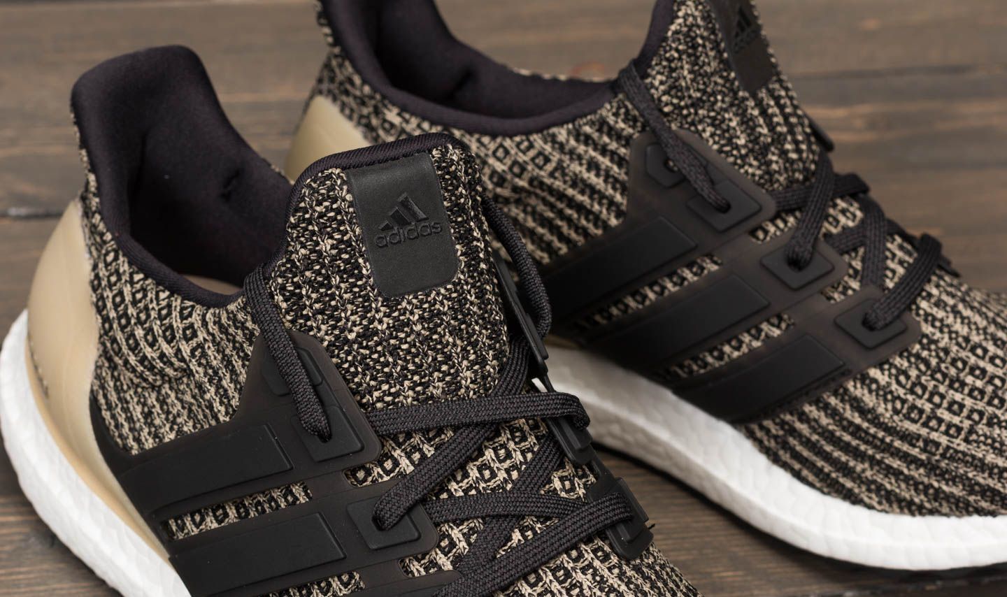 Ultra boost black raw gold new arrivals