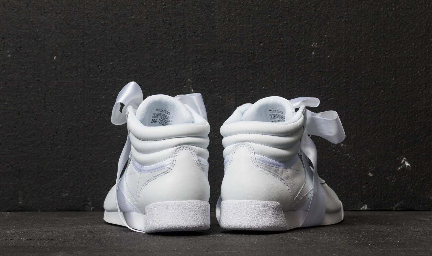 Women s shoes Reebok Freestyle Hi Satin Bow White Skull Grey