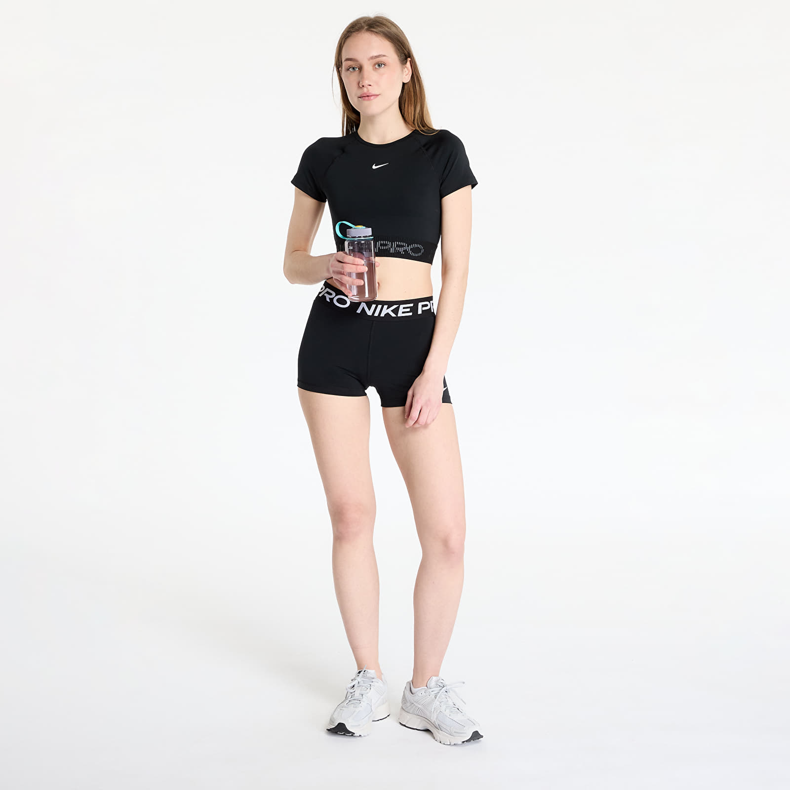 Sieviešu topi Nike Pro Women's Dri-FIT Short-Sleeve Cropped Graphic Top Black/ Cool Grey/ White