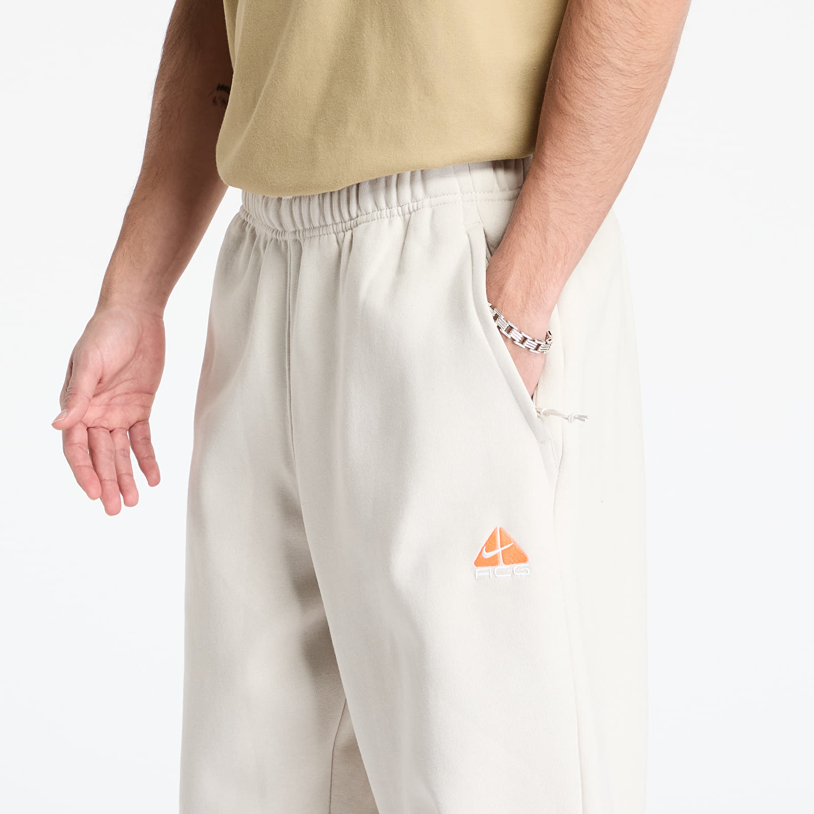 Tepláky Nike ACG Therma-FIT Repel Tuff Fleece Lungs Pants Lt Orewood Brn/ Hyper Crimson