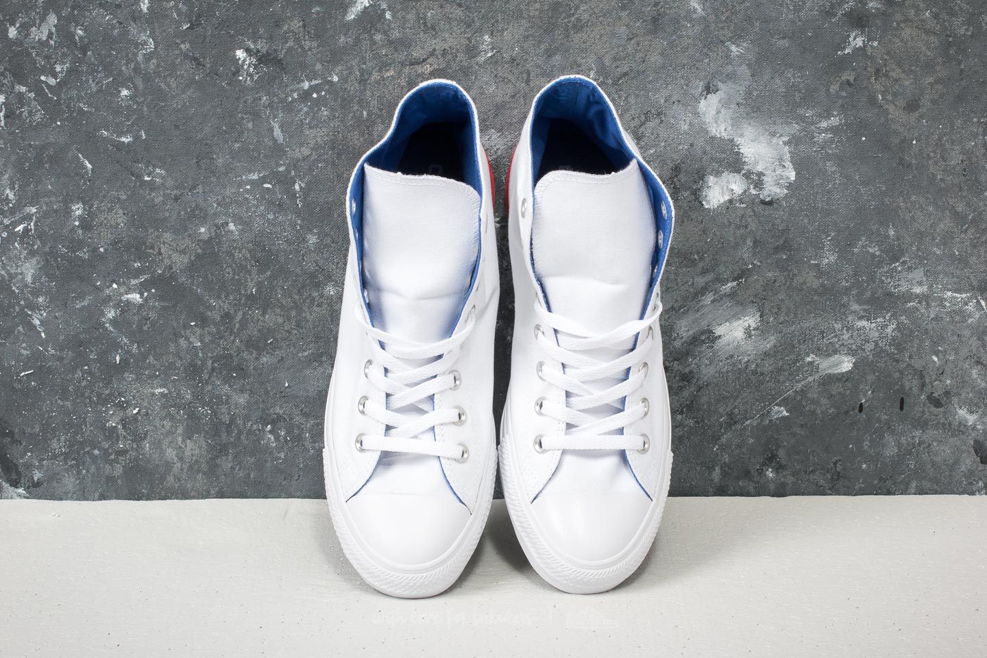 Red white and blue converse tennis shoes top