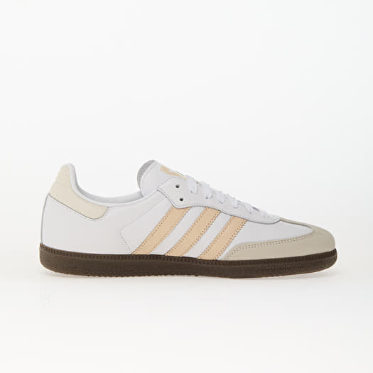 white adidas shoes with brown soles