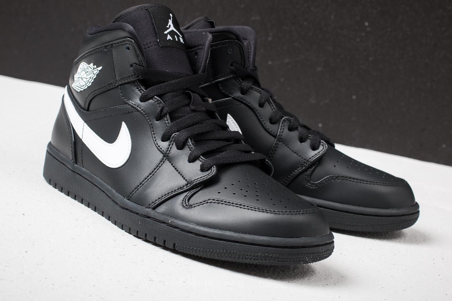 Men s shoes Air Jordan 1 Mid Black White Black Footshop