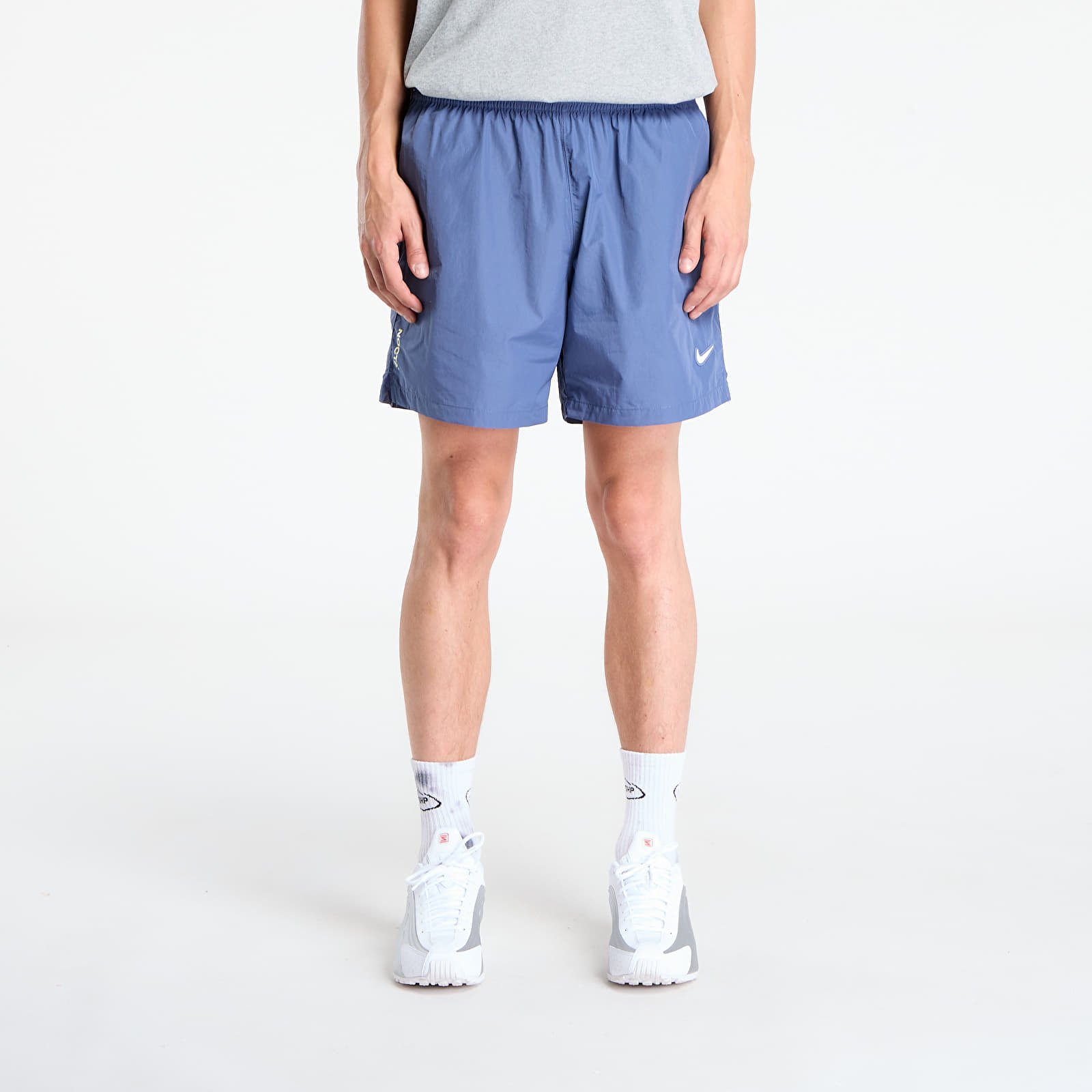 Šortai Nike x NOCTA Cardinal Nylon Shorts Diffused Blue/ Black/ Citron Tint