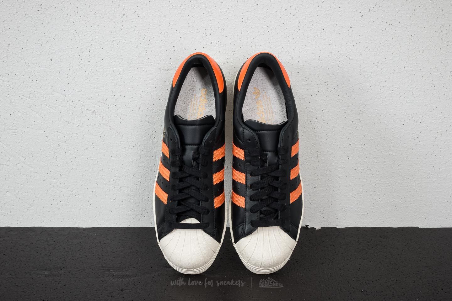 Adidas superstar discount black white orange