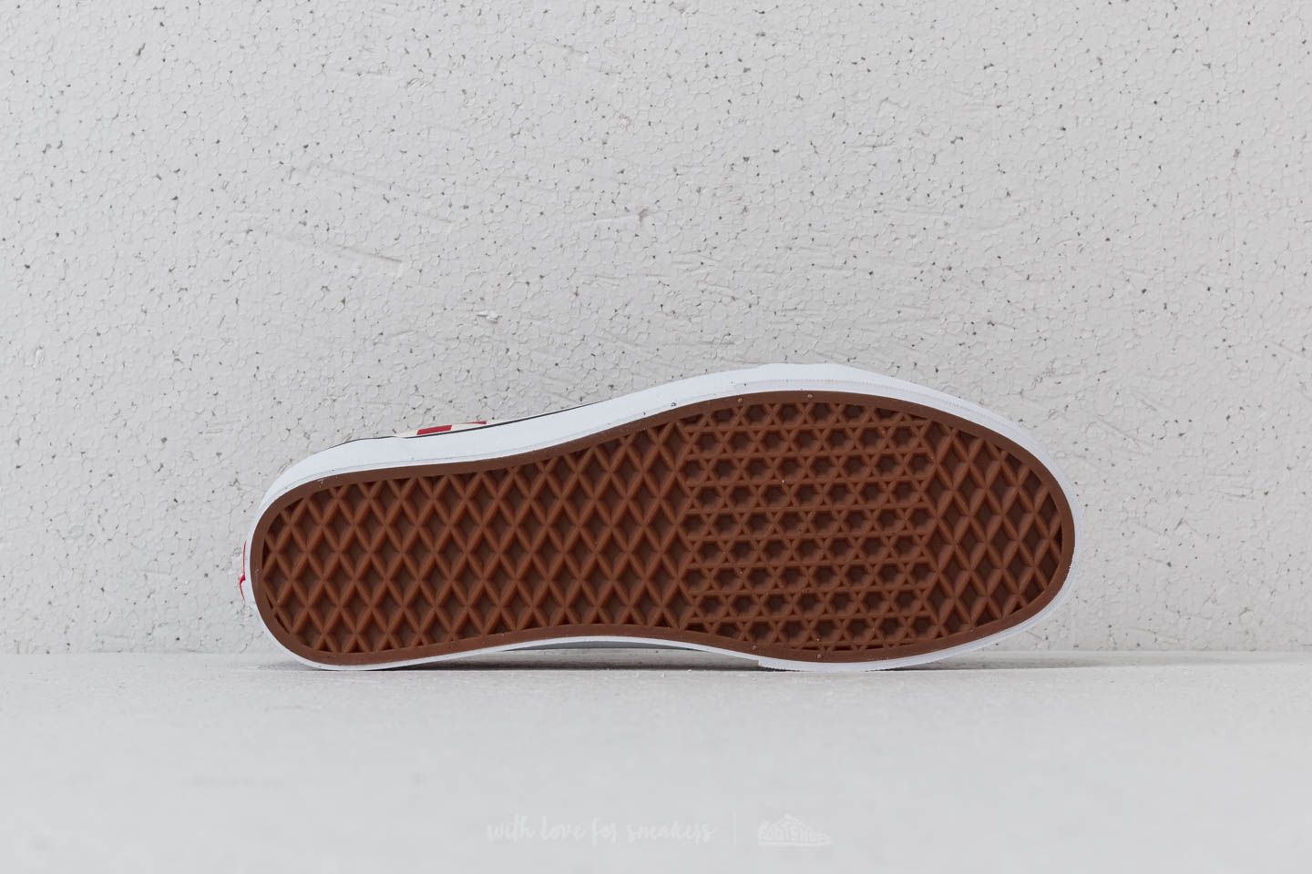 All red and black checkered 2025 vans