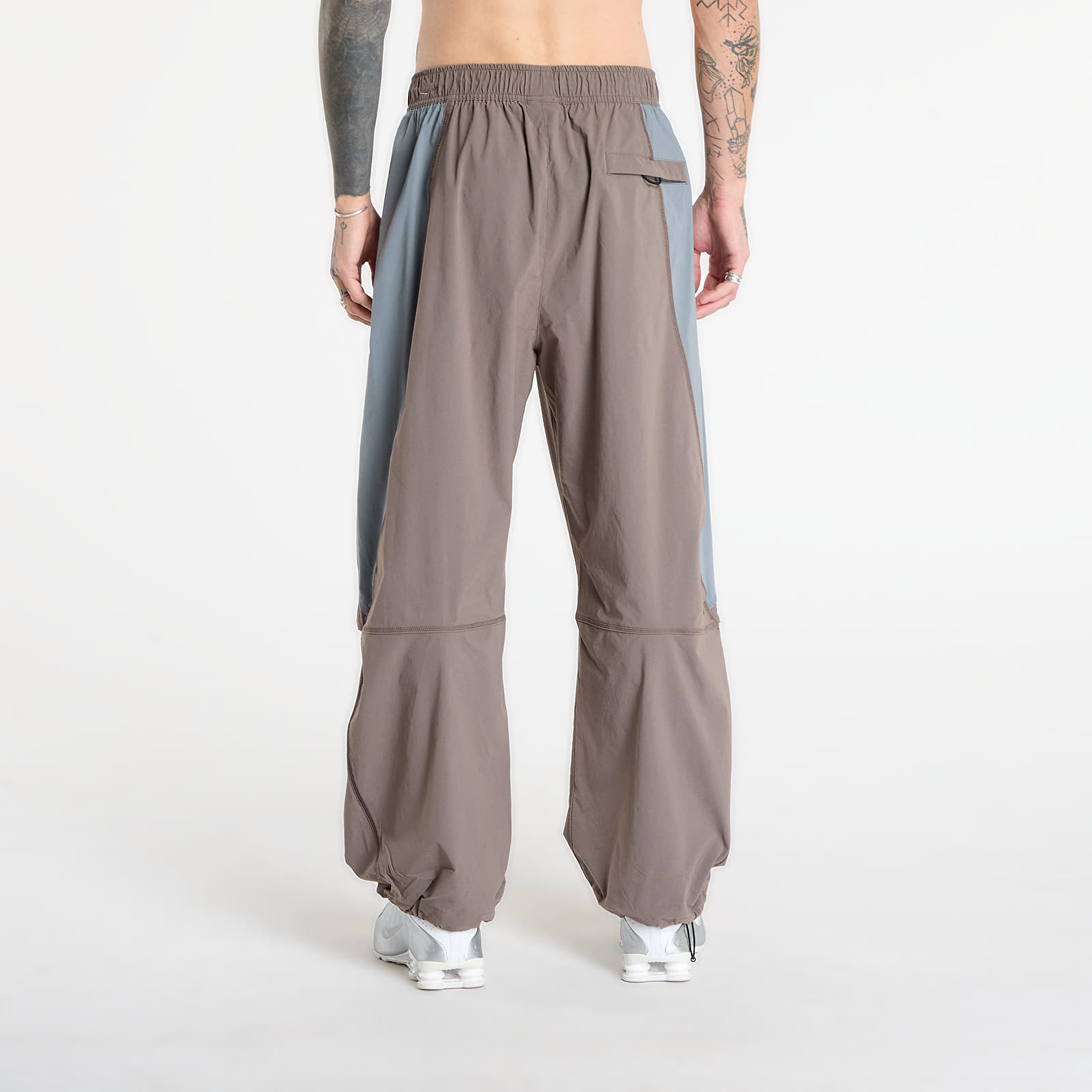Püksid Nike Tech Men's Dri-FIT Woven Color-Block Oversized Pants Cave Stone/ Cool Grey/ Black