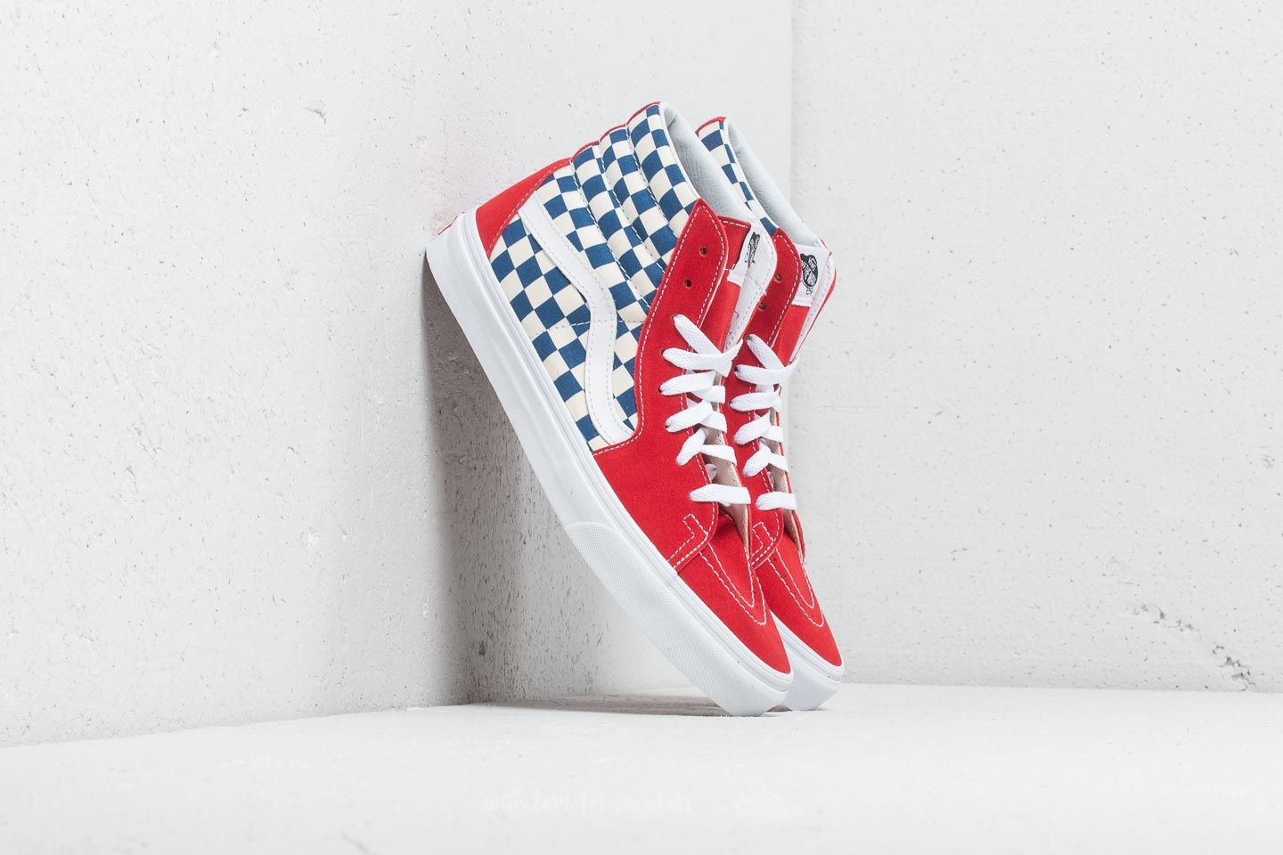 Red blue and store white checkerboard vans