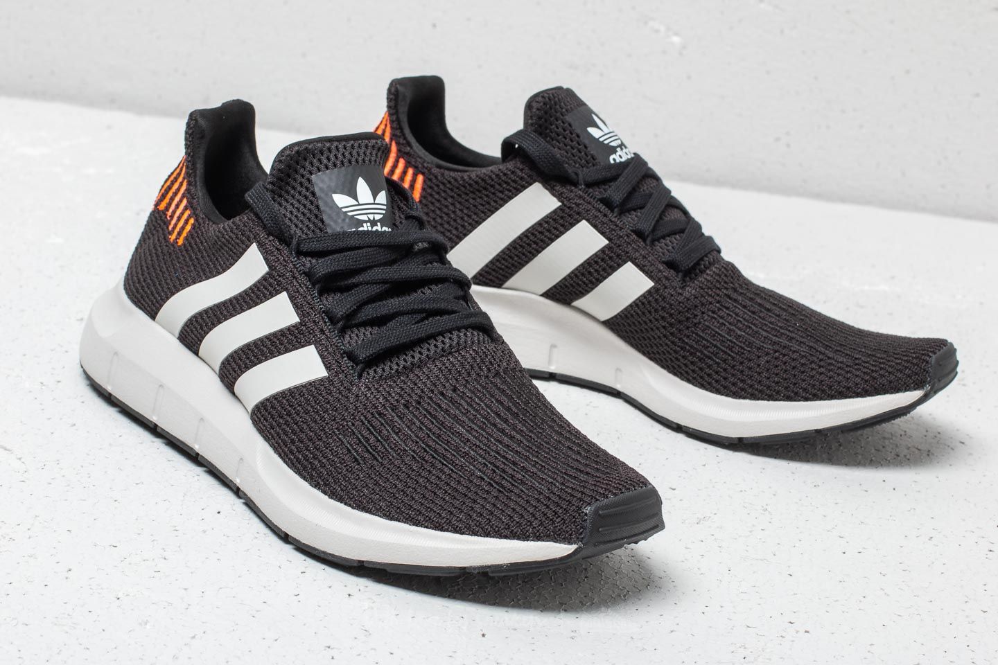 Swift run black orange & white shoes online