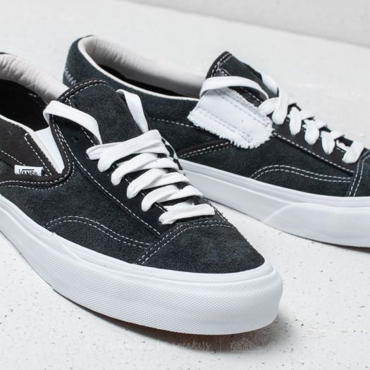 Vans slip on sale on cap black