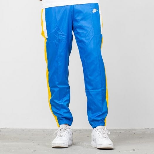 Blue and yellow nike pants sales