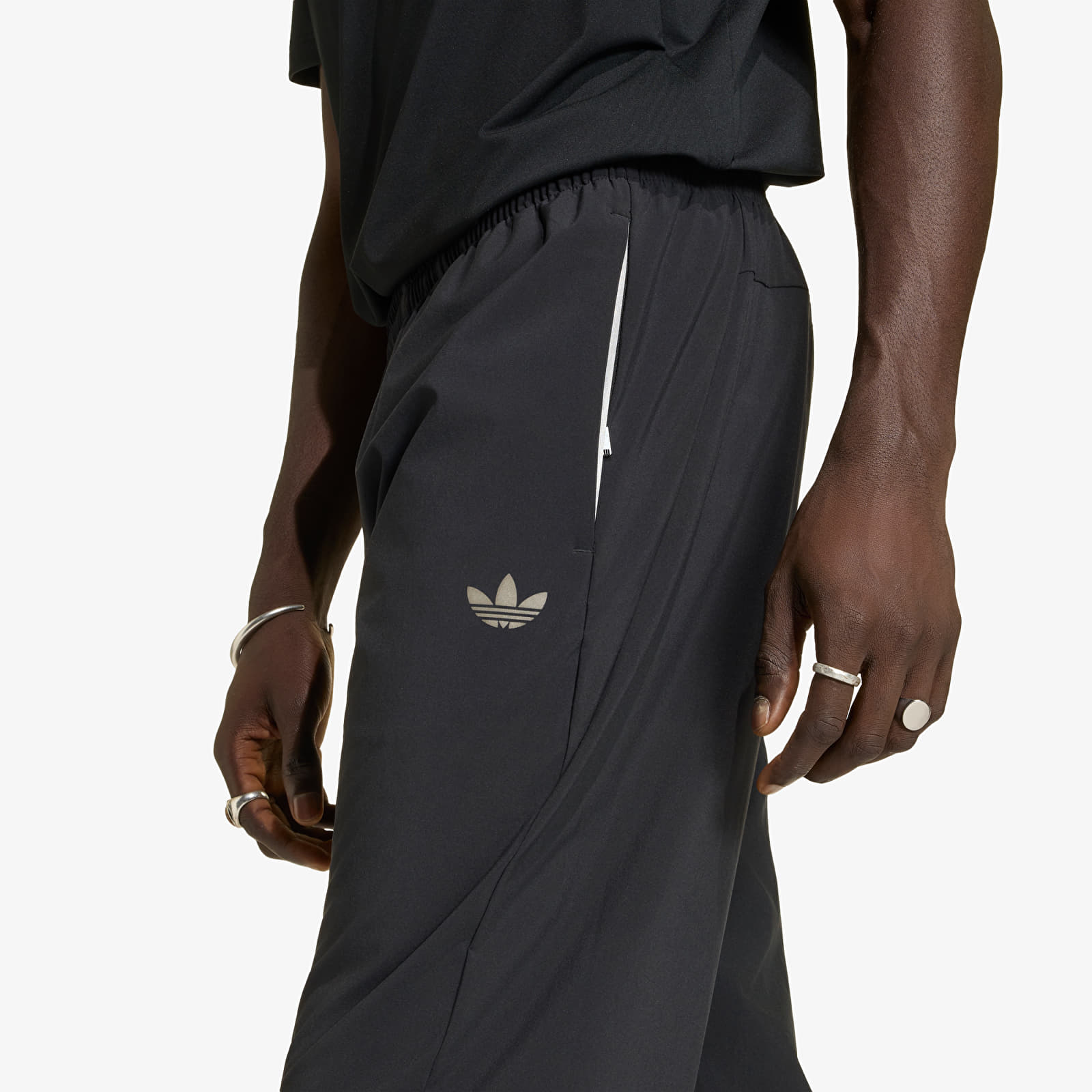 Hosen für Männer adidas Tech Trefoil Essentials Woven Pant Black