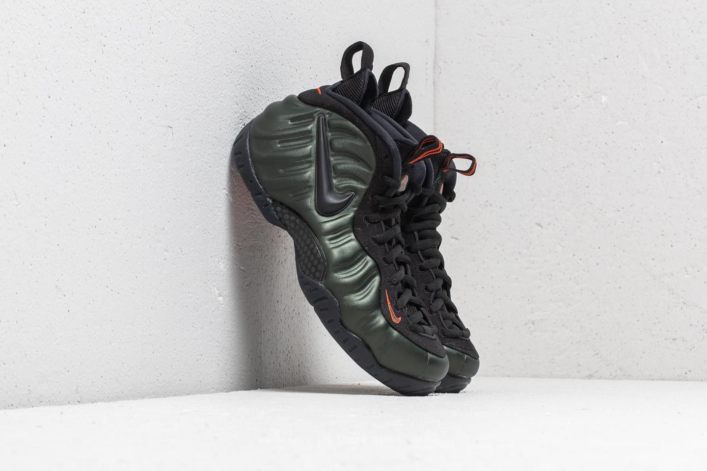 Black and orange nike foamposite best sale