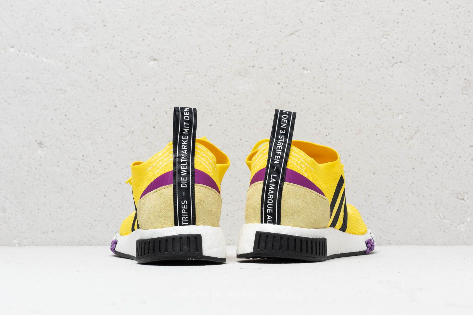 Adidas nmd store purple and yellow