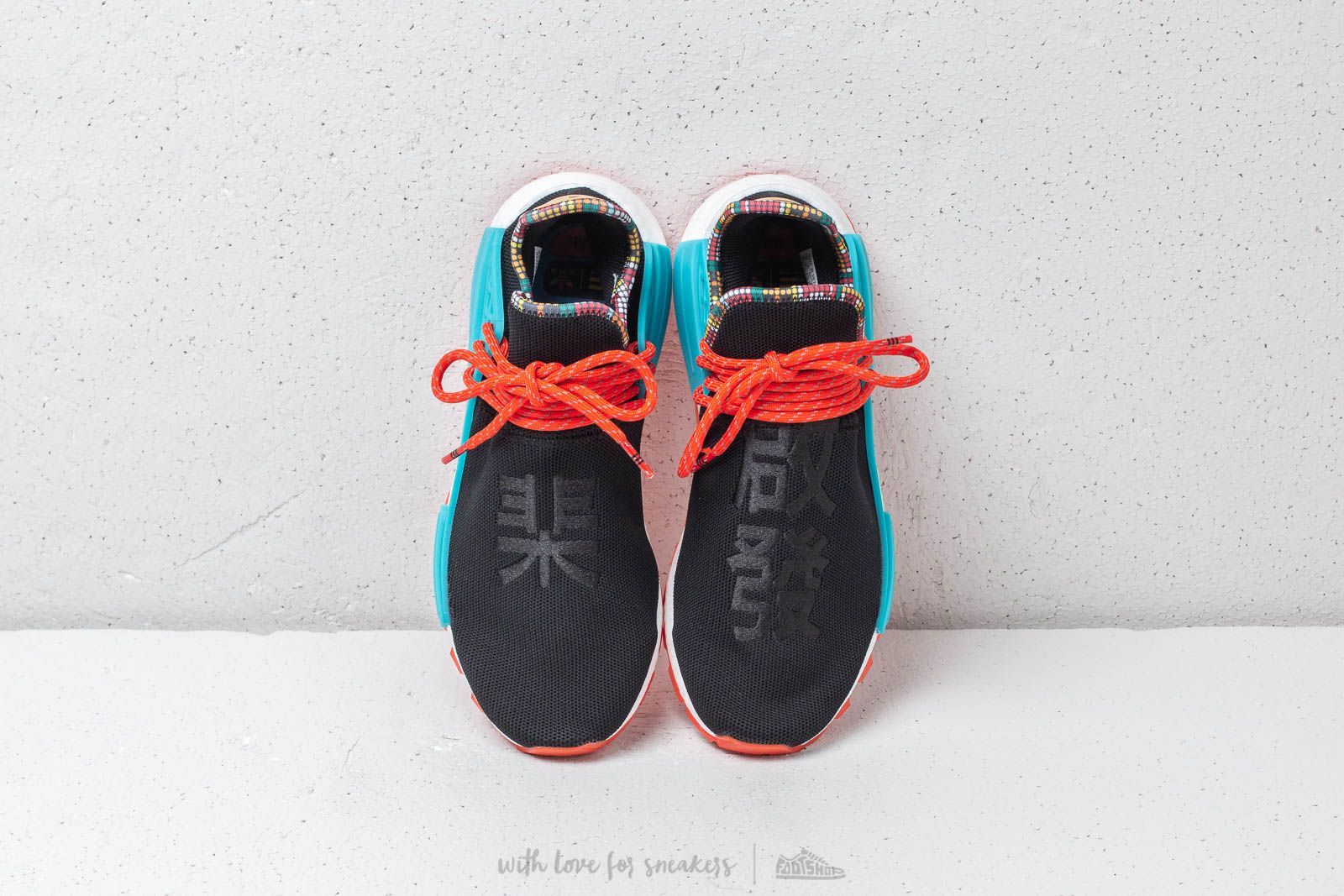 Adidas pharrell williams black and orange sales