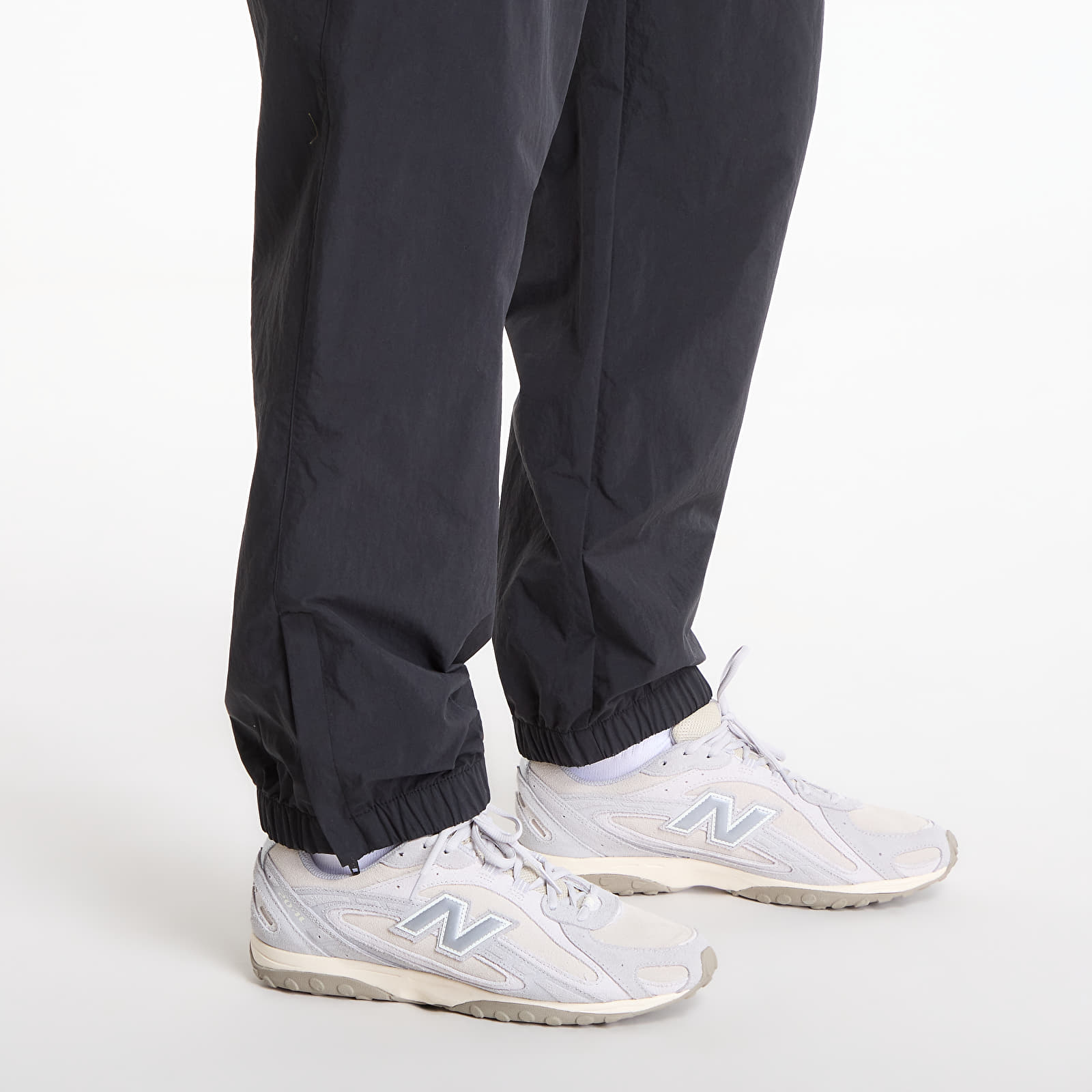 Jogginghosen Carhartt WIP Travon Pant UNISEX Black/ Wax
