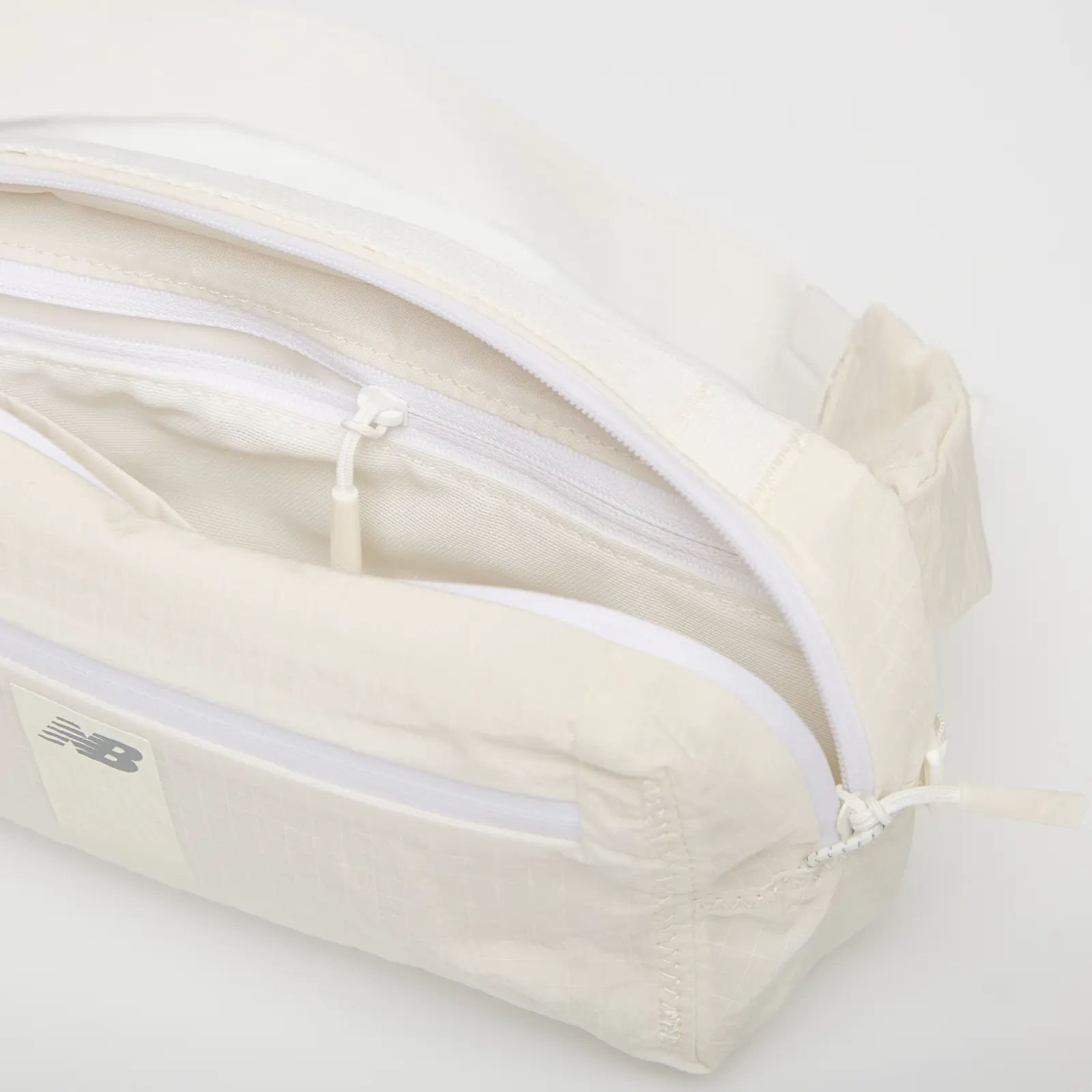 Genți de șold New Balance n Sling Belt Sea Salt